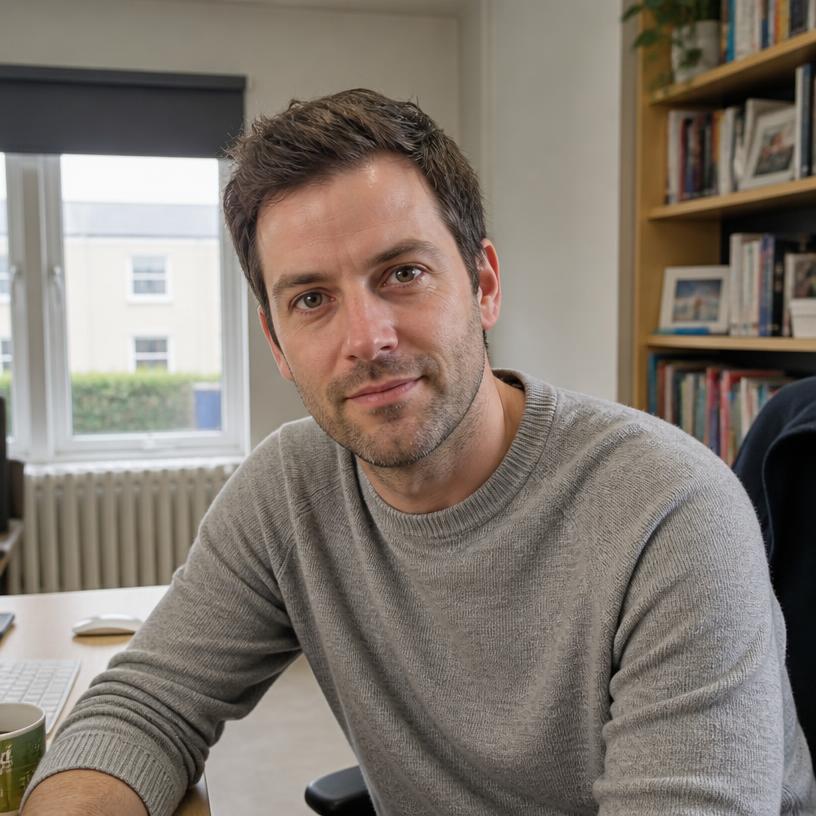 Oliver Bennett working at his desk in Bristol